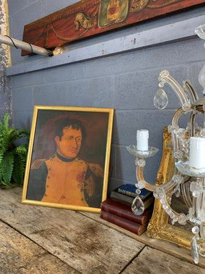 A framed oil on board painting of Napoleon