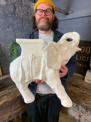 A large ceramic elephant jardiniere