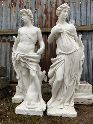 A very large pair of garden statues depicting Apollo and Diana