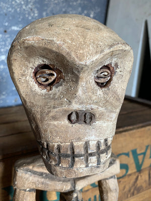 A carved wooden Congolese skeleton fetish figure