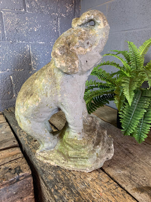 A large cast stone elephant