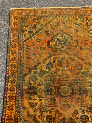 A large gold Persian rectangular rug - yellow/mustard tones