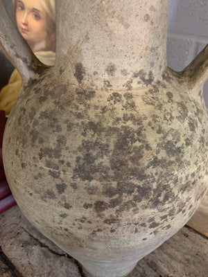 A large terracotta urn with double lug handles