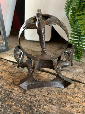 A large fortune teller's crystal ball on a bronze stand