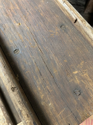 A dark wood floor standing school easel