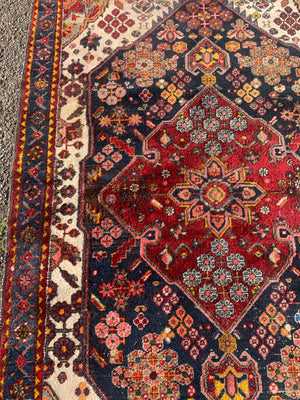 A Persian floral patterned rectangular rug
