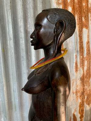 A large carved wooden Maasai figure