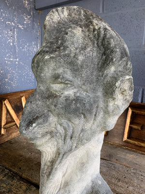 A large cast stone bust of Mephistopheles