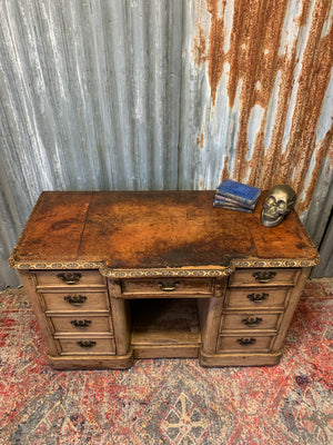 A Victorian limed oak pedestal desk