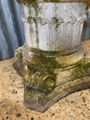 A very large acanthus urn on a column pedestal