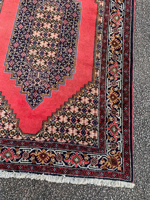 A red ground Sanandaj rug - 197cm x 128cm