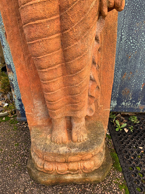 A large cast stone Buddha statue