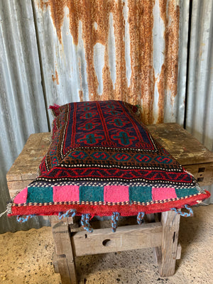 A large rectangular red ground Persian carpet floor cushion