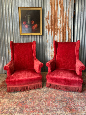 A pair of French red velvet armchairs