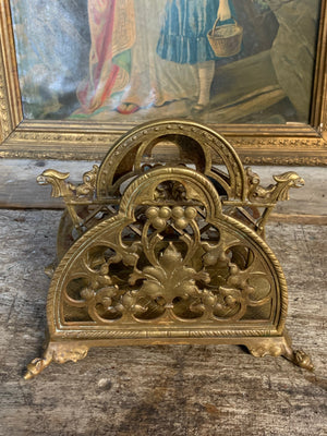 A gilt bronze Gothic letter rack with bat and griffin motifs