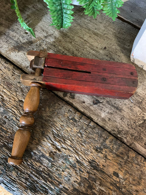 A wooden "New College" football rattle