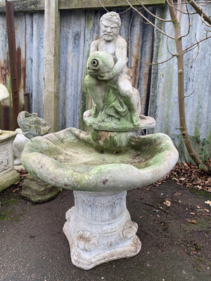 A Neptune stone garden fountain
