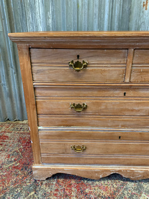 A limed tramline chest of drawers