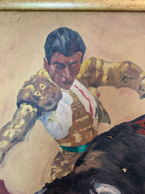 A framed oil on canvas painting of a matador