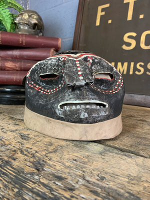 A metal Makonde helmet mask ~B