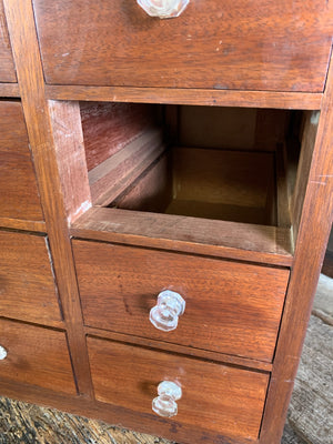 A bank of 12 apothecary drawers