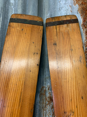 A pair of vintage wooden oars