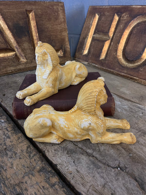 A pair a plaster sphinxes
