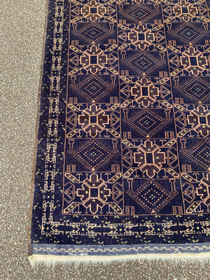 A midnight blue ground rug - 217cm x 115cm