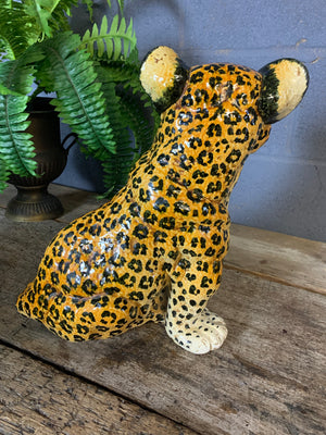 A large Hollywood Regency leopard cub statue