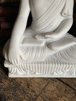 A large bonded marble Buddha statue