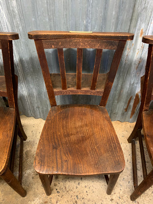 A set of 4 wooden 19th century chapel chairs