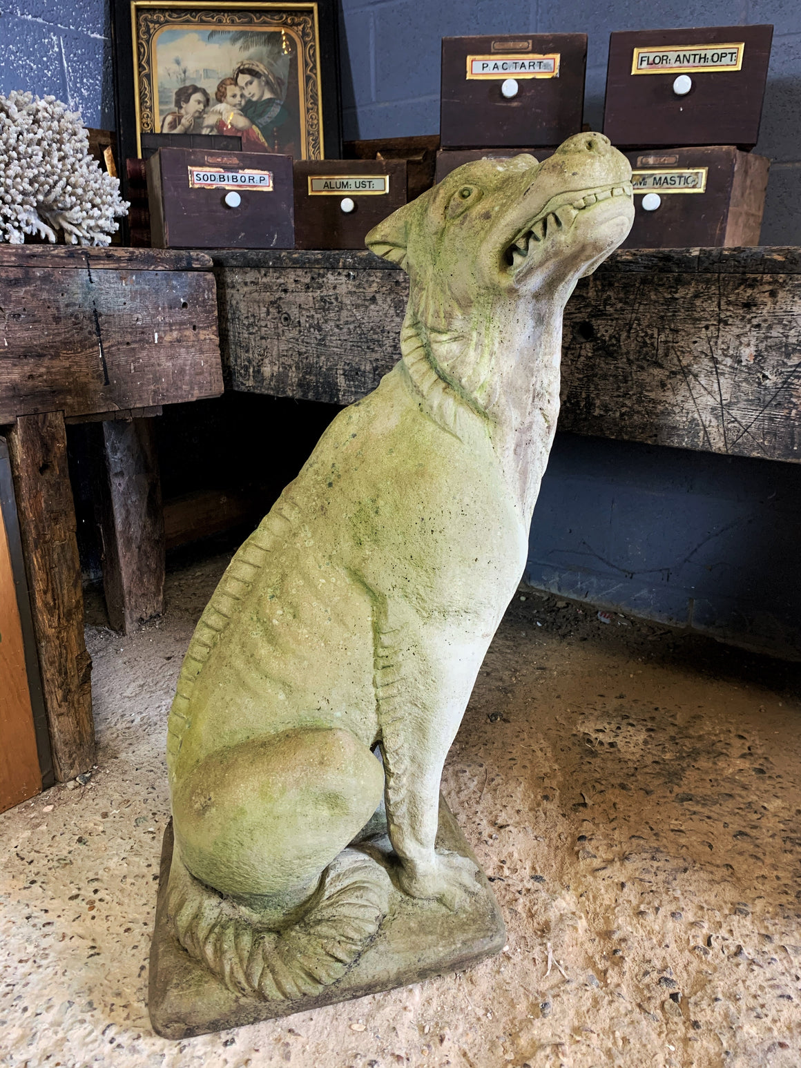 A cast stone garden statue of a mythical hound - 97cm