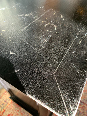 An ebonised shop counter