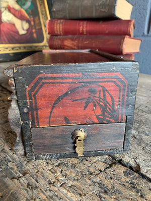 A carved wooden Chinese box with dragon motifs