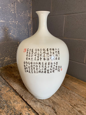 A large white Chinese porcelain vase depicting the Eighteen Arhats