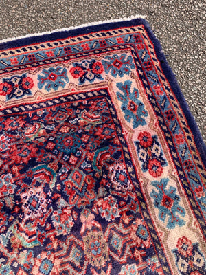 A large Persian blue ground runner - 285 x 116cm