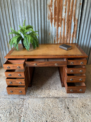 A Victorian tan leather pedestal desk on castors