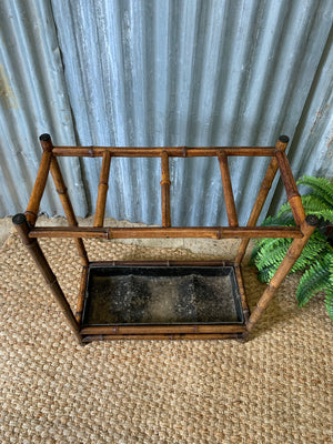 A bamboo stick stand with metal liner