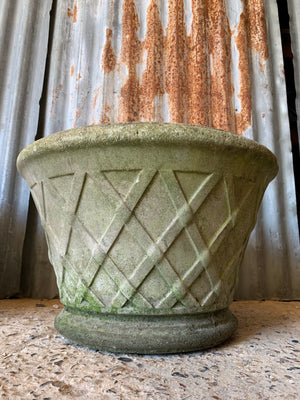 A pair of large round lattice cast stone urns