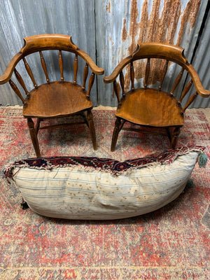 A large rectangular Persian carpet floor cushion