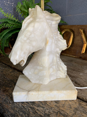 An alabaster and marble horse head table lamp