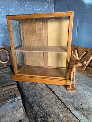 A glass table top shop display cabinet
