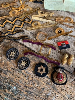 A naval bicorn hat, tin, epaulettes and other insignia