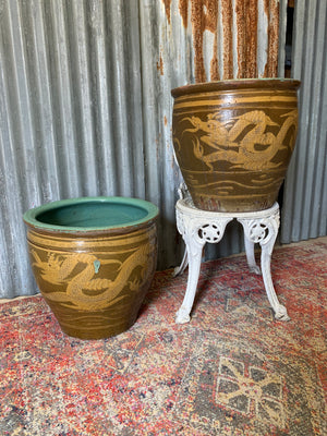 A pair of glazed earthenware dragon ‘egg’ pots