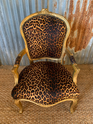 A leopard print giltwood open armchair