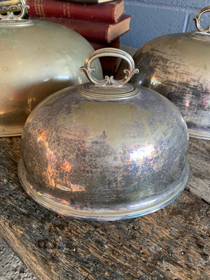 A trio of graduated silver plate meat cloches by Walker & Hall