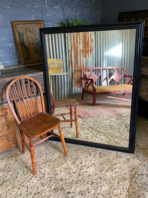 A large rectangular ebonised mirror