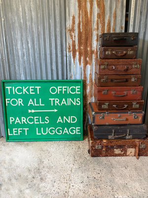 A large hand painted railway ticket office sign