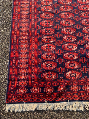 A silk red ground Bokhara rug - 204cm x 105cm