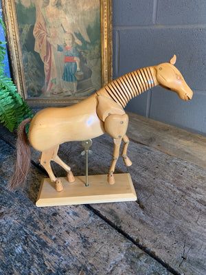 A large wooden horse lay figure